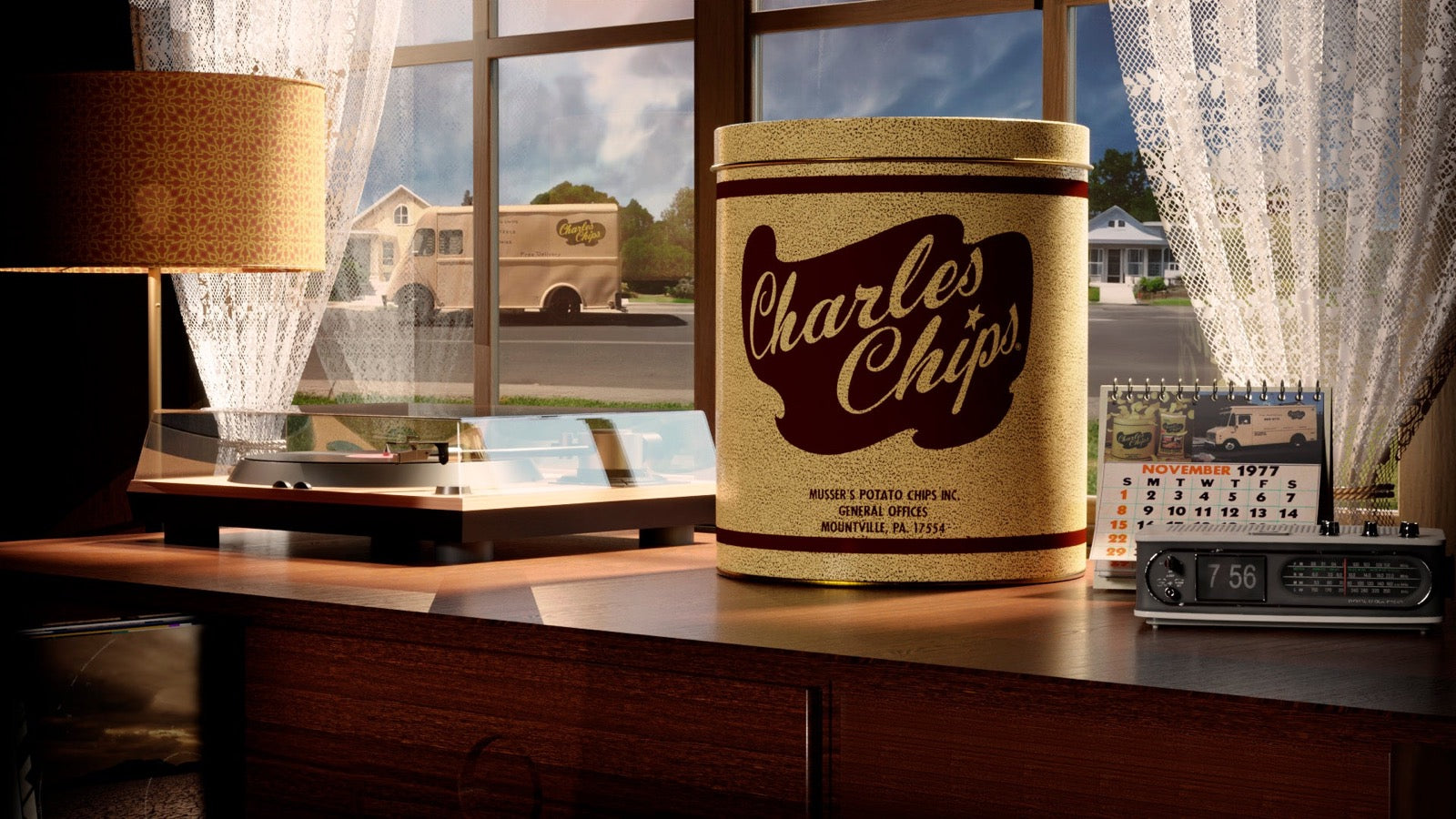 A Charles Chips tin from Mountville, PA on a windowsill, with the delivery truck parked outside